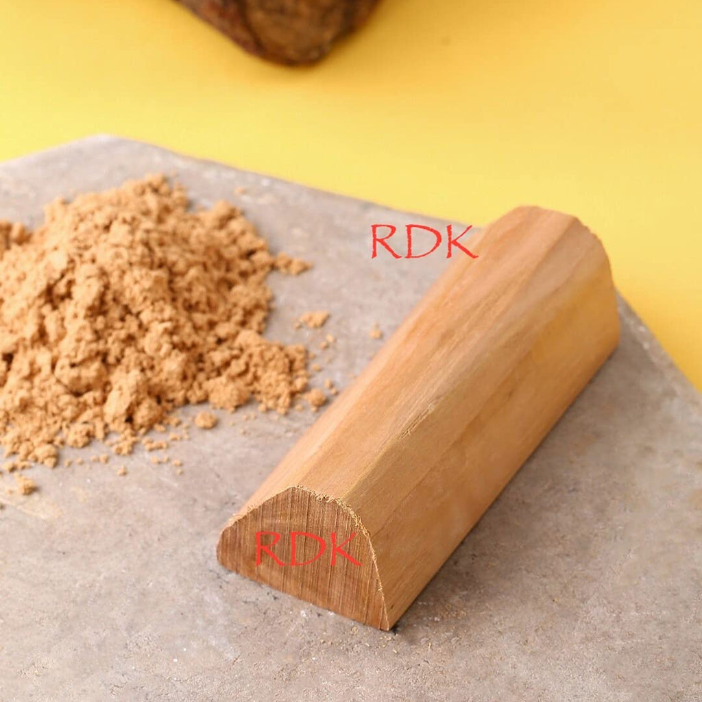 Wooden rolling pin with 'RDK' branding on a yellow background